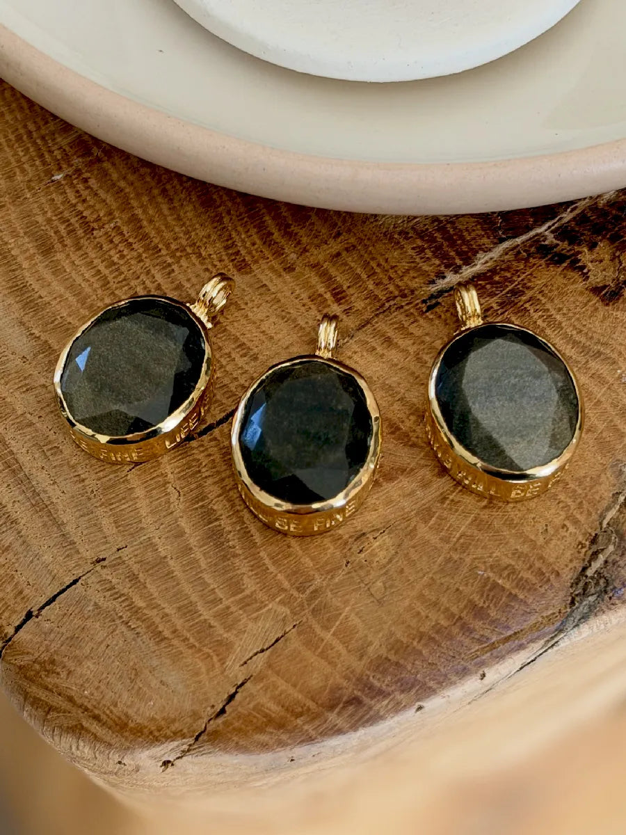 MÉDAILLON MANTRA OBSIDIENNE DORÉE
